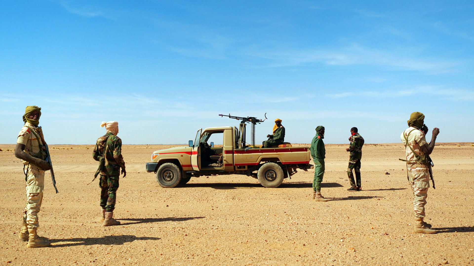 Maenner mit Gewehren